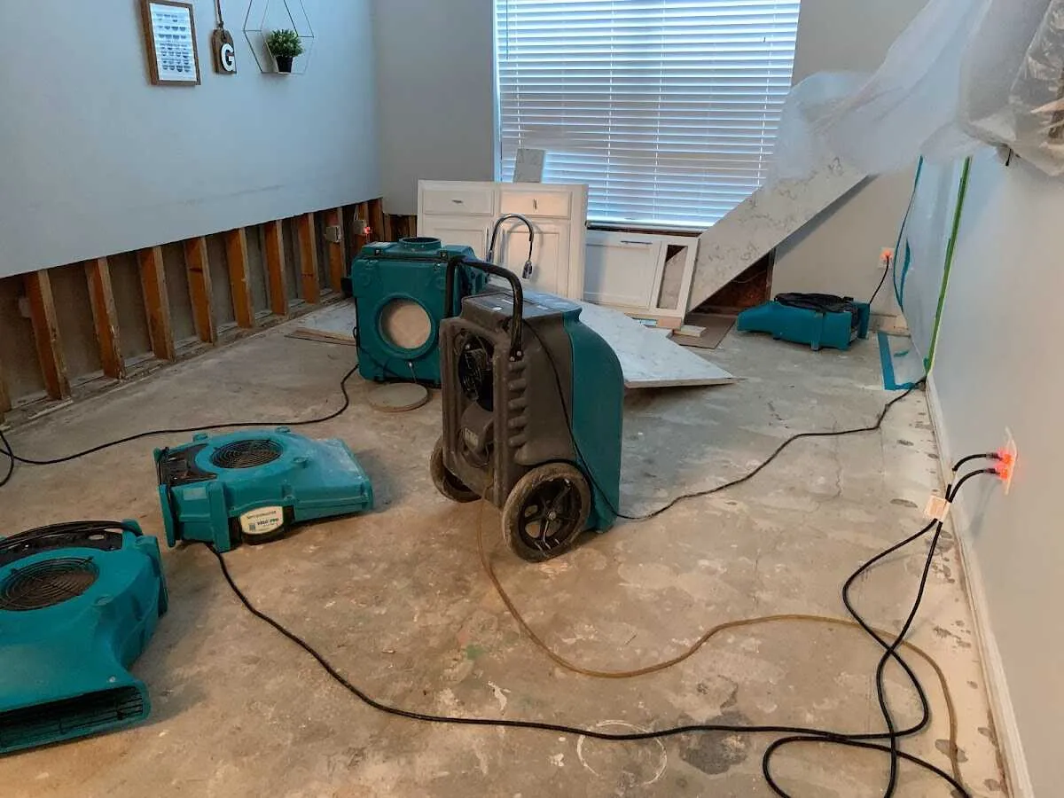 Dehumidifier in flood-cut room for Water Damage Restoration in Pikesville